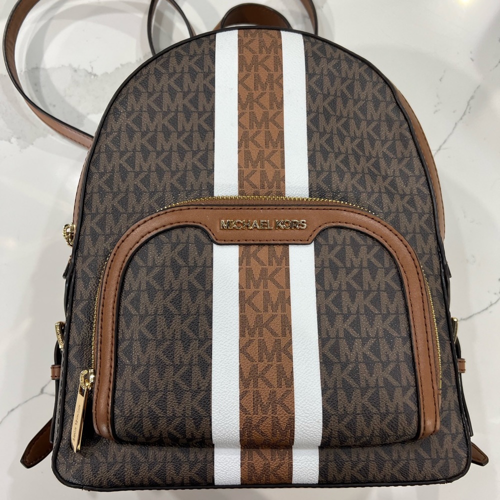 Barely used- looks brand new- Michael kors back pack